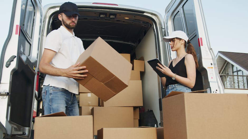 A stylish and elegant image of movers carefully handling luxurious items during a move.