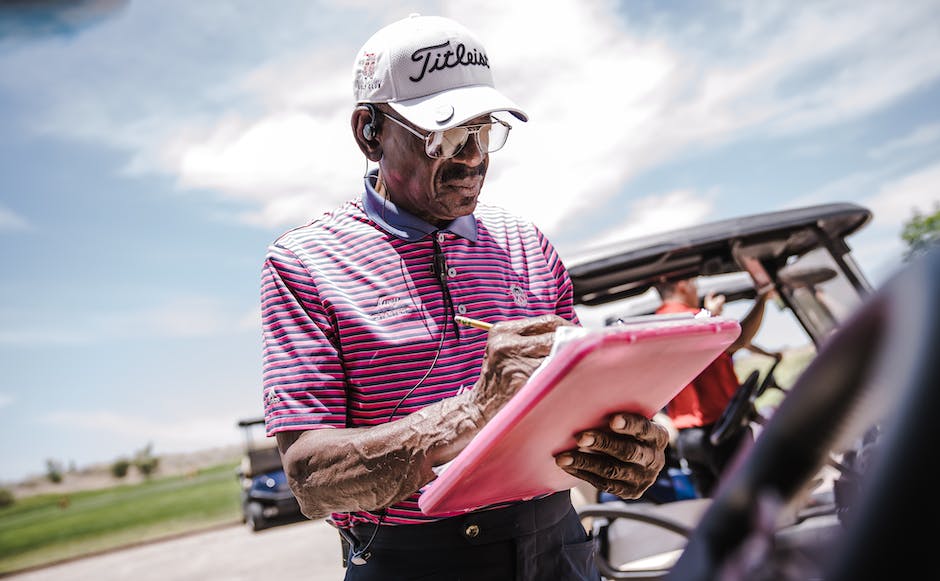 A picture of a person holding a clipboard and checking off items on a checklist.