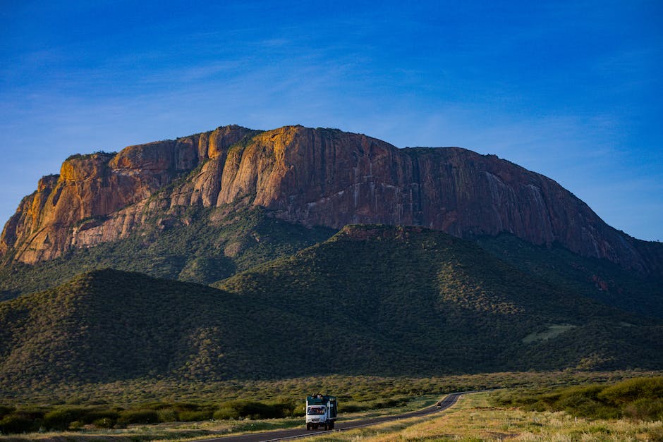 An image of a moving truck traveling along a highway, symbolizing the long-distance moving industry