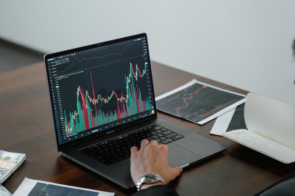 Image of a person looking at market charts and graphs, symbolizing understanding market dynamics for success in an industry