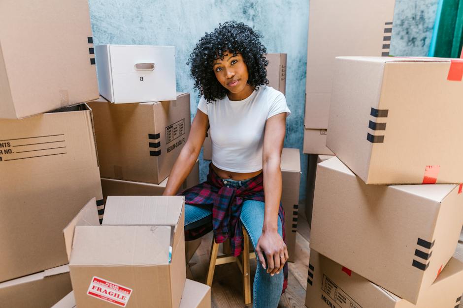 An image showing various moving and packing supplies such as boxes, tape, and bubble wrap.