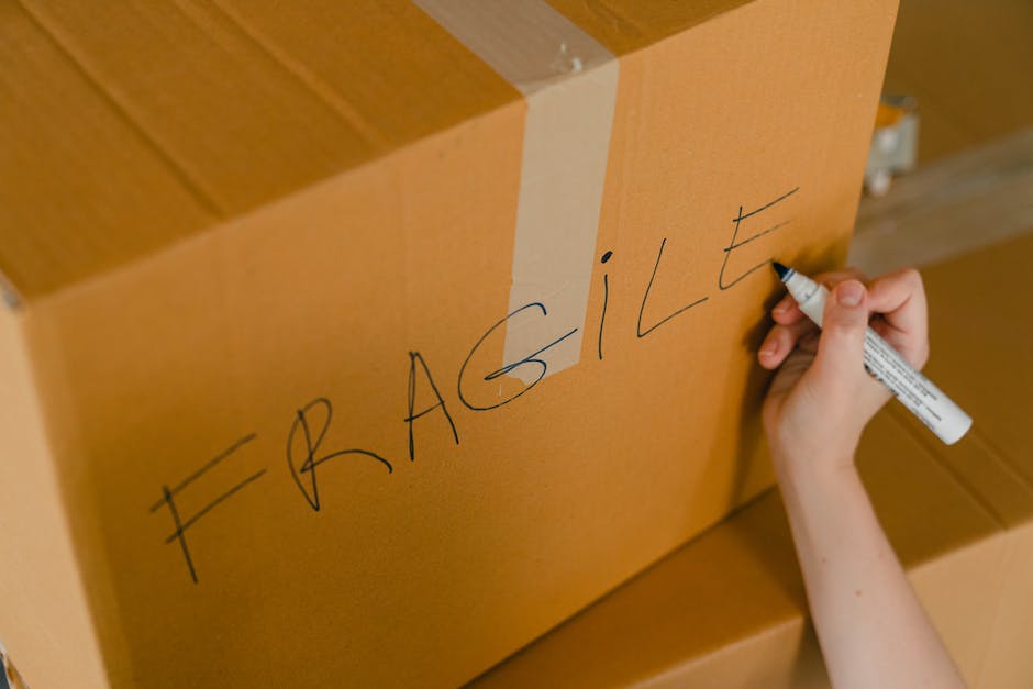 Image of a moving company's logo and truck, representing the concept of moving services and transportation for someone that is visually impaired