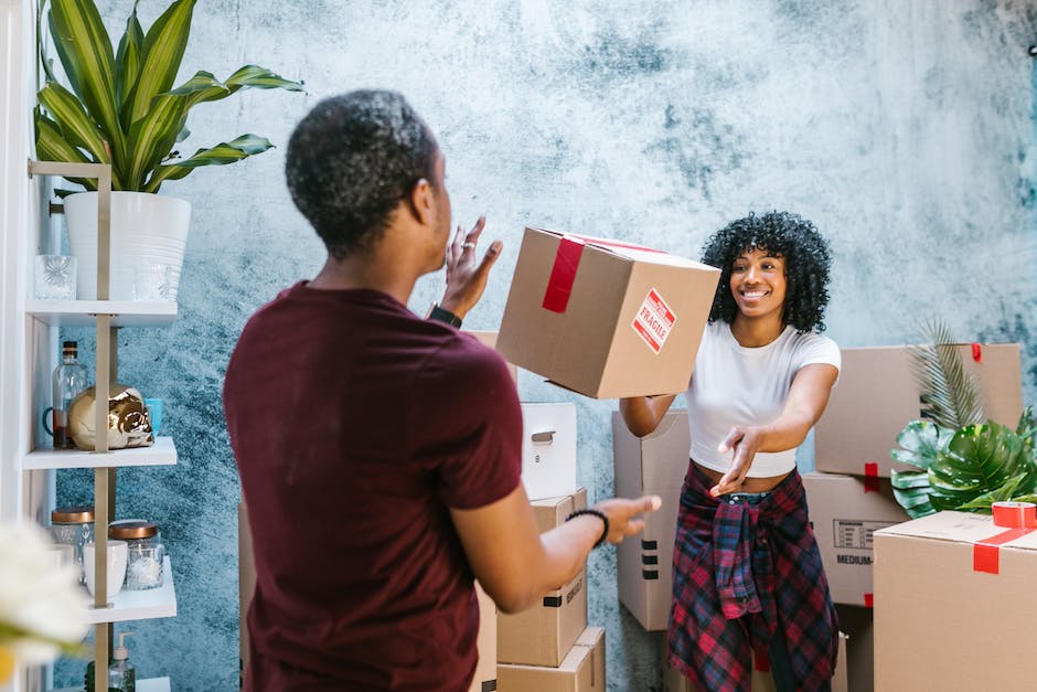 A group of movers carrying furniture during a house move