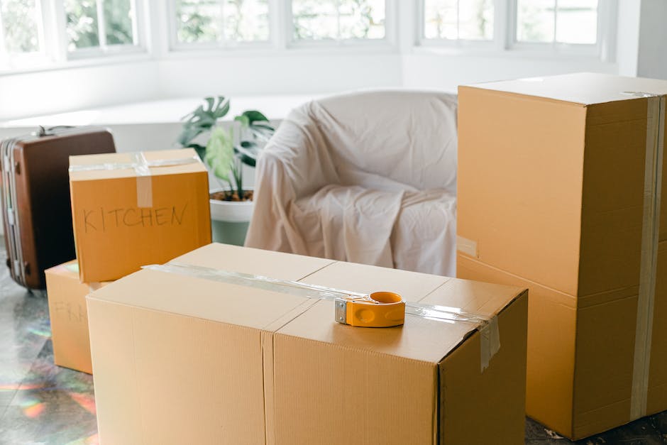 Image description: A group of movers packing and transporting household items