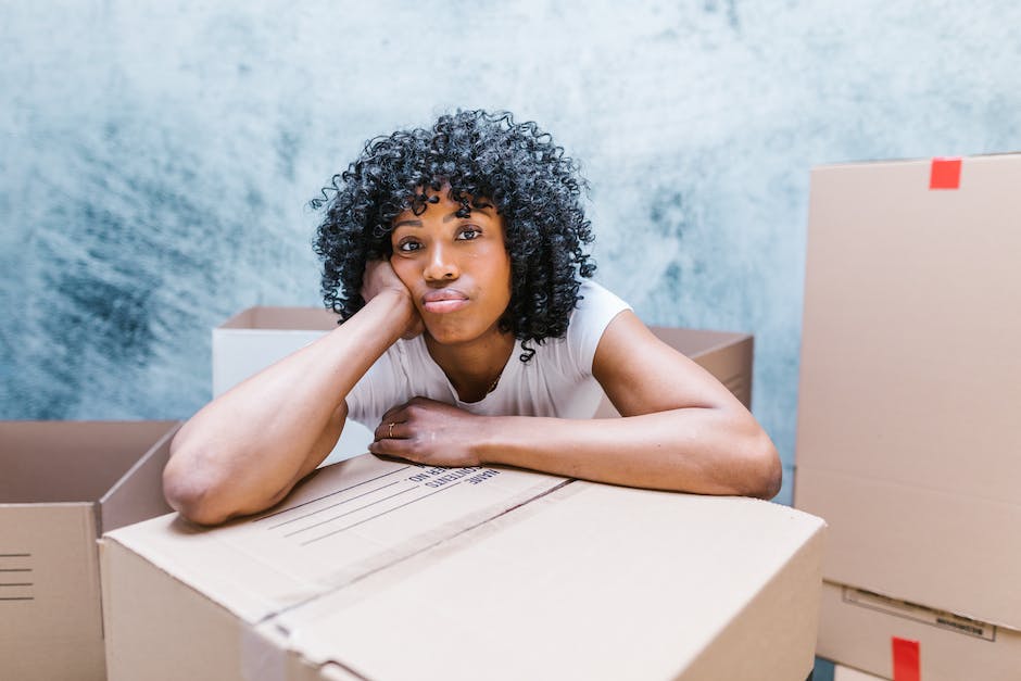 A group of movers lifting furniture and boxes, symbolizing the moving industry