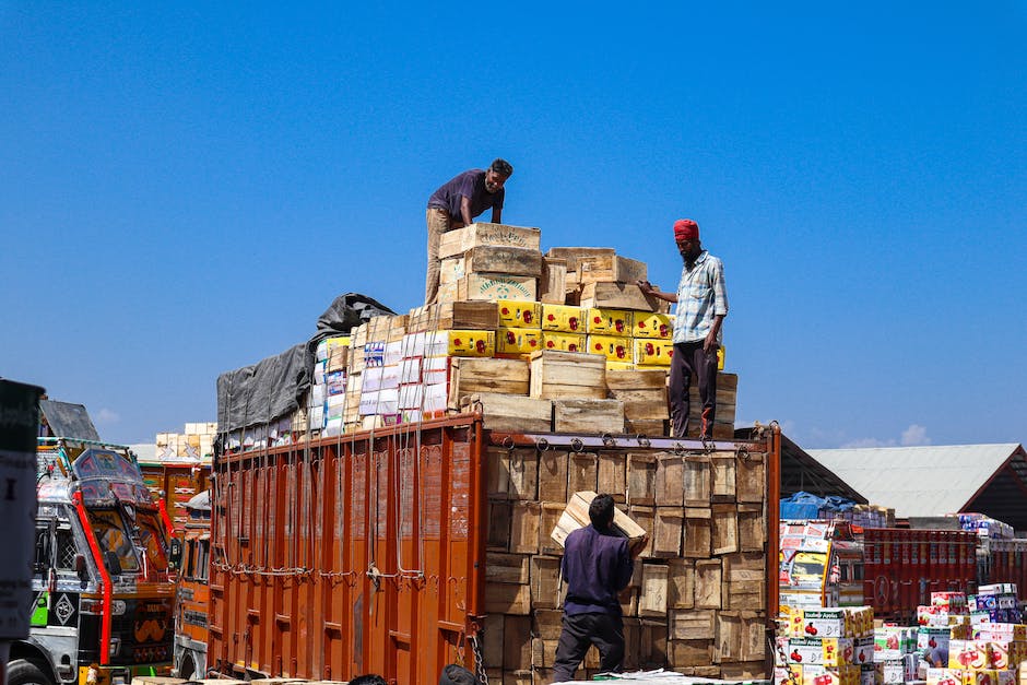 Illustration of movers loading boxes onto a truck