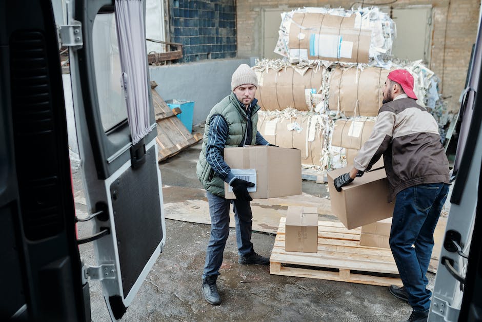 An image depicting professional movers carefully loading boxes onto a moving truck