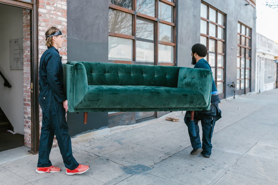 Image of a person using a smartphone app to book a moving service