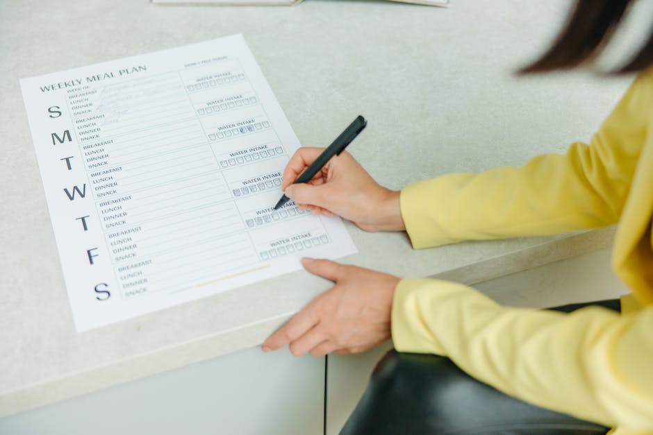 A checklist with pen and boxes, representing the essentials of post-move tasks